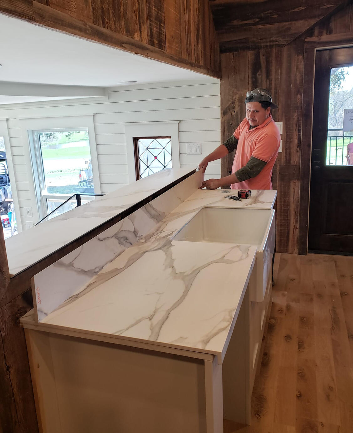 Juan carefully measuring out the half-backsplash for new counter installation.