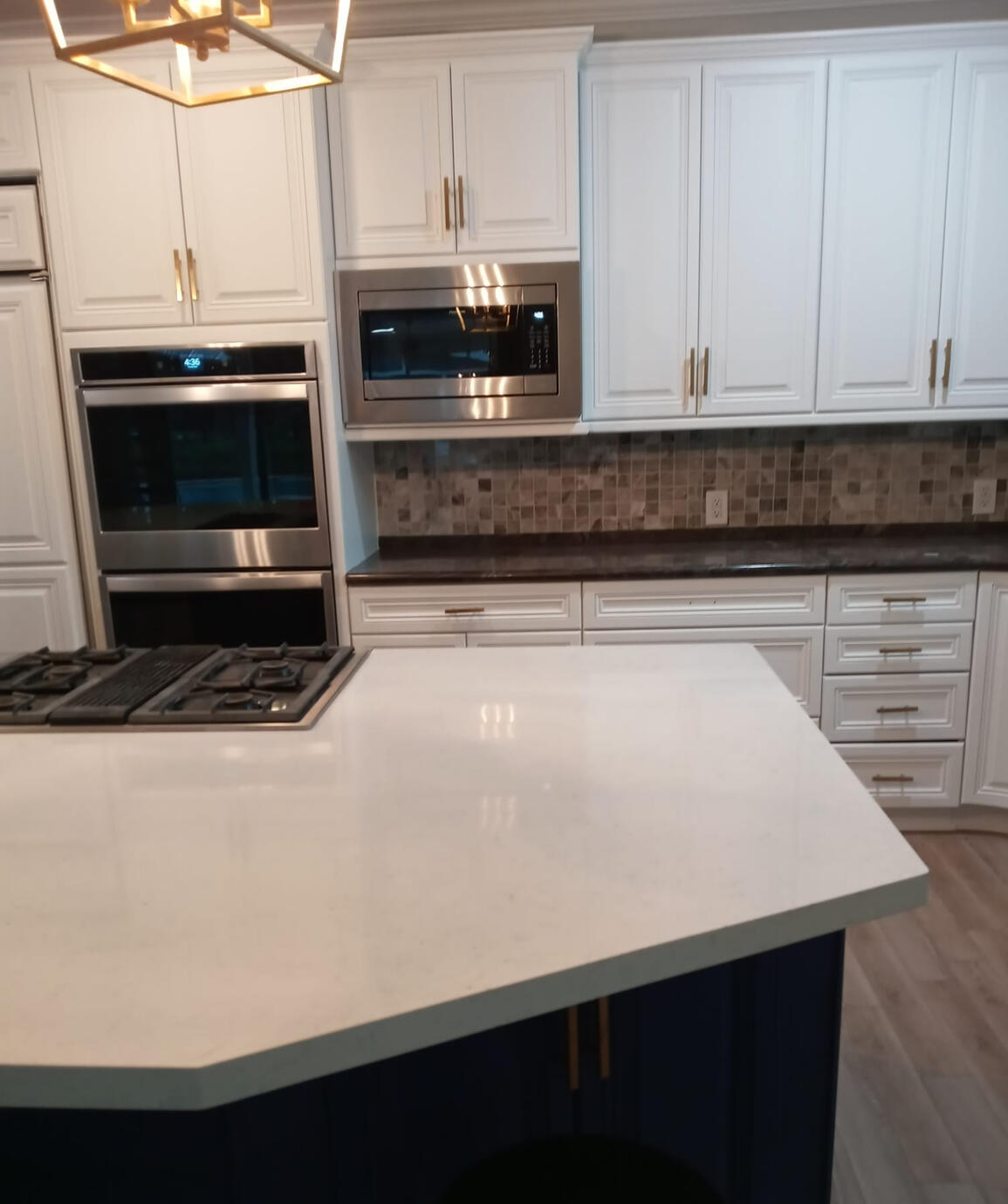 Beautiful white granite countertop that exemplifies the cutting skills through its angles.